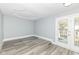 Bedroom featuring a decorative ceiling, neutral walls, and access to a deck at 821 S Lebanon St, Lebanon, IN 46052