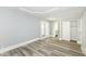 Bedroom features a decorative ceiling, neutral walls, wood-look flooring, and backyard access at 821 S Lebanon St, Lebanon, IN 46052