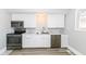 Modern kitchen with stainless steel appliances, marble countertops, and white cabinetry at 821 S Lebanon St, Lebanon, IN 46052