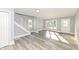 Cozy living room featuring staircase, large window, neutral paint, and modern flooring at 821 S Lebanon St, Lebanon, IN 46052
