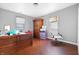 Bedroom featuring hardwood floors, an armoire, and a window at 821 S Worth Ave, Indianapolis, IN 46241