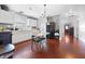 Bright kitchen features white cabinets, wood floors, and a black refrigerator at 821 S Worth Ave, Indianapolis, IN 46241