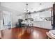 Cozy kitchen showcases white cabinets, black appliances and wood floors at 821 S Worth Ave, Indianapolis, IN 46241