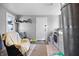 Bright laundry room features gray walls, a window, and a washer and dryer at 821 S Worth Ave, Indianapolis, IN 46241