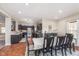 Open layout with view of kitchen, dining area with dark-toned furniture and pendant lighting at 8335 S Shady Trail Dr, Pendleton, IN 46064