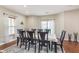 Bright dining area with a neutral color palette and modern, decorative lighting at 8335 S Shady Trail Dr, Pendleton, IN 46064