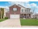 Charming two-story home with a brick facade, attached garage, and well-manicured front lawn at 8335 S Shady Trail Dr, Pendleton, IN 46064