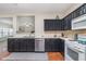 Kitchen with stainless steel dishwasher and views to other rooms at 8335 S Shady Trail Dr, Pendleton, IN 46064