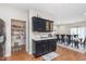 Kitchen with a large pantry, wine rack, and views into the dining room at 8335 S Shady Trail Dr, Pendleton, IN 46064