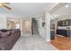 Spacious living room featuring a staircase and an open floorplan to the kitchen at 8335 S Shady Trail Dr, Pendleton, IN 46064