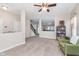 Open-plan living room featuring soft carpeting, neutral walls, and seamless flow into other spaces at 8335 S Shady Trail Dr, Pendleton, IN 46064