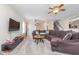 Cozy living area featuring a sectional sofa, a wall-mounted television, and open layout at 8335 S Shady Trail Dr, Pendleton, IN 46064