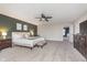 Primary bedroom with ceiling fan, neutral walls, and access to walk-in closet at 8335 S Shady Trail Dr, Pendleton, IN 46064
