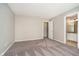 Carpeted bedroom with ensuite bathroom at 9049 Southernwood Way, Indianapolis, IN 46231
