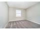 An empty carpeted bedroom with a window at 9049 Southernwood Way, Indianapolis, IN 46231