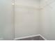 Walk-in closet with carpet floor and white wire shelving offering ample storage space at 9049 Southernwood Way, Indianapolis, IN 46231