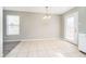 Dining room with tiled floors and modern lighting at 9049 Southernwood Way, Indianapolis, IN 46231