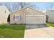 Charming single-story home featuring a one car garage, lawn, and neutral siding at 9049 Southernwood Way, Indianapolis, IN 46231