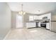Bright eat-in kitchen with white cabinets, stainless steel appliances, and tile flooring at 9049 Southernwood Way, Indianapolis, IN 46231