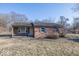 Cozy one-story brick home with a well-maintained front yard and classic architectural details at 960 W 52Nd St, Indianapolis, IN 46208