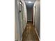 Hallway features original hardwood floors and neutral gray paint at 960 W 52Nd St, Indianapolis, IN 46208