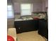A kitchen featuring tile flooring, white cabinets, and a stainless steel sink at 960 W 52Nd St, Indianapolis, IN 46208