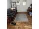 Spacious living room area with hardwood floors, a gray rug, a leather couch, and natural light at 960 W 52Nd St, Indianapolis, IN 46208