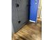 The room features a storage cabinet against a blue wall with hardwood floors at 960 W 52Nd St, Indianapolis, IN 46208