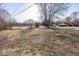 The expansive yard features open spaces and mature trees, creating a serene natural setting at 960 W 52Nd St, Indianapolis, IN 46208