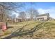 Wide-angle view of the backyard showcasing a shed, playground, and spacious grassy area at 10111 Ironway Dr, Indianapolis, IN 46239