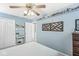 Serene bedroom in soft blue with a geometric art piece and bright, natural lighting at 10111 Ironway Dr, Indianapolis, IN 46239