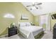 Bright bedroom with vaulted ceilings, and a modern ceiling fan and lighting at 10111 Ironway Dr, Indianapolis, IN 46239