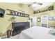 Spacious Primary bedroom with vaulted ceiling, a large dresser, and decorative shelving at 10111 Ironway Dr, Indianapolis, IN 46239