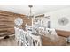 Inviting dining area featuring a decorative wood accent wall and a large chandelier at 10111 Ironway Dr, Indianapolis, IN 46239