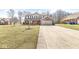 Charming two-story home featuring a brick and siding exterior with a welcoming front porch and two-car garage at 10111 Ironway Dr, Indianapolis, IN 46239