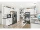 Modern kitchen with white cabinets, black appliances, granite countertops, and a breakfast bar at 10111 Ironway Dr, Indianapolis, IN 46239