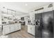 Open concept kitchen and living room featuring a large kitchen island and modern appliances at 10111 Ironway Dr, Indianapolis, IN 46239