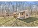 Backyard outbuilding with porch, adjacent to swing set and play structure at 10111 Ironway Dr, Indianapolis, IN 46239