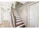 Wooden staircase featuring white risers and a wooden handrail at 10111 Ironway Dr, Indianapolis, IN 46239