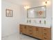 Bathroom featuring double vanity with stone countertop and wood cabinetry at 1026 Jefferson Ave, Indianapolis, IN 46201