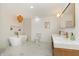 Bright bathroom with free standing tub, marble tile, and gold hardware at 1026 Jefferson Ave, Indianapolis, IN 46201