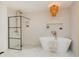Bathroom featuring free standing tub and glass shower at 1026 Jefferson Ave, Indianapolis, IN 46201