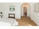 Bedroom featuring hardwood floors and arched doorway at 1026 Jefferson Ave, Indianapolis, IN 46201