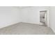 Neutral bedroom featuring plush carpeting and a doorway leading to another room at 1026 Jefferson Ave, Indianapolis, IN 46201