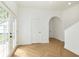 Bright entryway featuring French doors, Herringbone flooring and an arched doorway at 1026 Jefferson Ave, Indianapolis, IN 46201