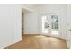 Bright foyer with french doors to back yard featuring herringbone floors at 1026 Jefferson Ave, Indianapolis, IN 46201