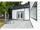 Back of home featuring new siding, new windows and a gray stained deck at 1026 Jefferson Ave, Indianapolis, IN 46201