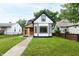 Charming renovated home with black trim, new siding, and landscaped front yard at 1026 Jefferson Ave, Indianapolis, IN 46201