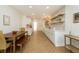 Modern kitchen with white cabinetry, stainless steel appliances, and open dining area at 1026 Jefferson Ave, Indianapolis, IN 46201