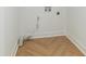 Laundry room with a herringbone floor and washer/dryer hookups at 1026 Jefferson Ave, Indianapolis, IN 46201